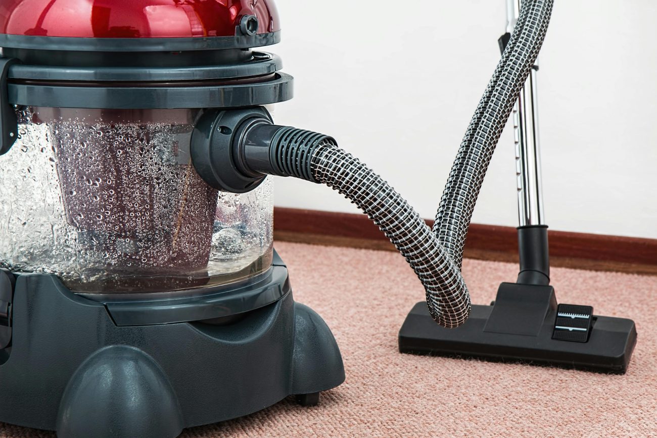 checking vacuum cleaner hose for clogs